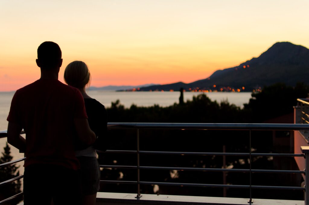 Couple looking over sunset